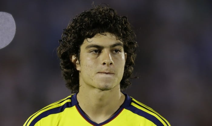 Colombia's Stefan Medina stands before the start of a 2014 World Cup qualifying soccer match in Montevideo, Uruguay, Tuesday, Sept. 10, 2013. (AP Photo/Natacha Pisarenko)