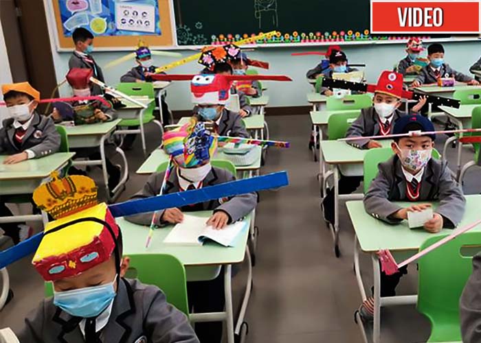 Niños chinos, como robotcitos regresan al colegio