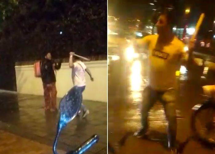 VIDEO: A punta de palo taxista ataca a rappitendero y rompe una moto que no tenía nada que ver