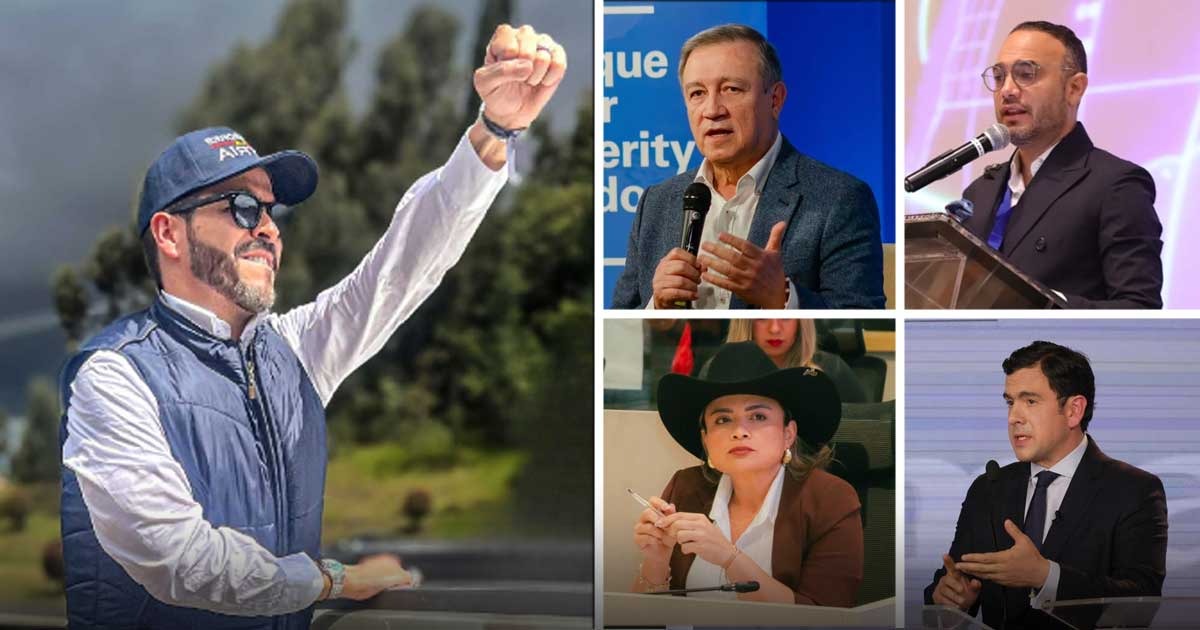 Man in a blue cap and puffer vest raises his fist outdoors, smiling, with trees and hills in the background. - Los políticos tradicionales que acompañan a Abelardo de la Espriella por encima y por debajo de la mesa