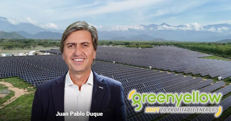 Juan Pablo Duque standing in front of a vast solar farm, with the GreenYellow logo and the slogan 'SHIFT TO PROFITABLE ENERGY!' in the foreground. - Los franceses de Green Yellow entran con fuerza en las granjas solares del país