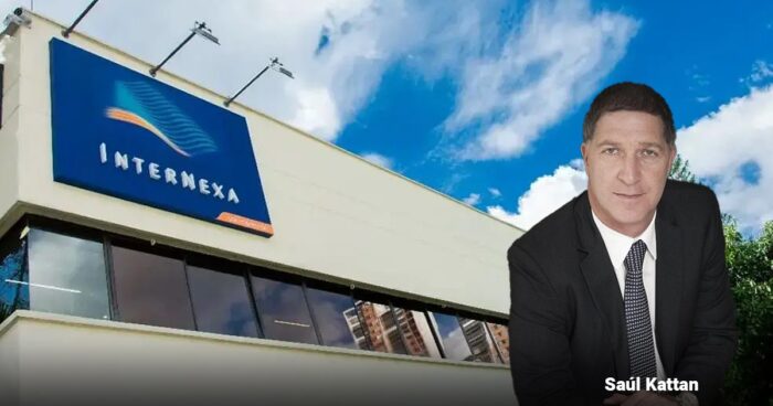 Petro insiste en su ambicioso y polémico sueño con 3 centros de datos en Santa Marta InterNexa office building with blue logo sign; a businessman in a dark suit stands in the foreground (text 'Saúl Kattan' seen). - Petro insiste en su ambicioso y polémico sueño con 3 centros de datos en Santa Marta