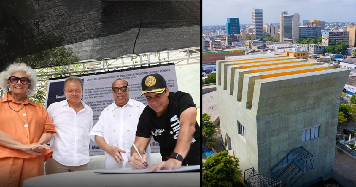 Four people at an outdoor signing ceremony; a man in black signs a document while others watch. - Tres constructoras que lograron levantar el Museo de Arte Moderno de Barranquilla