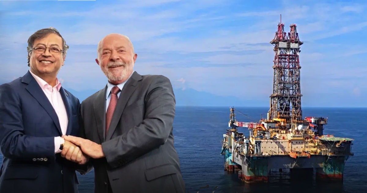 Two businessmen in suits shake hands with an offshore oil rig in the background. - Después de casi dos meses de exploración brasileros y colombianos encontraron gas en el caribe frente al Parque Tayrona