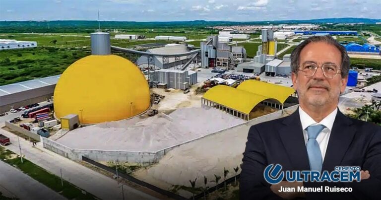 Las2orillas.co: Historias, voces y noticias de Colombia Promotional image of a cement factory with a large yellow dome and a man in a suit in the foreground, Ultracem Cemento branding. - Las2orillas.co: Historias, voces y noticias de Colombia