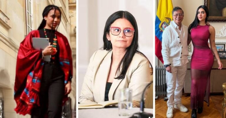 Las2orillas.co: Historias, voces y noticias de Colombia Woman wearing a red cape-like garment and black outfit walks outdoors while holding a tablet or folder in front of a building edge away from camera. - Las2orillas.co: Historias, voces y noticias de Colombia