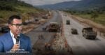 Governor Jorge Emilio Rey speaks into a microphone beside a highway under construction on a rural road project. - Vía libre para la construcción del puente Tibanica en Bosa, beneficiará a 250 mil personas de Ciudad Verde