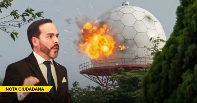 Man in a suit speaks in front of a large exploding dome structure during a news segment labeled NOTA CIUDADANA. - Con drones artesanales, los grupos criminales le miden el pulso a Abelardo de la Espriella