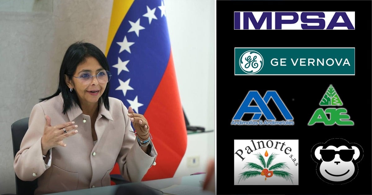 Woman in a light blazer speaks at a desk during a meeting, with a Venezuelan flag in the background. On the right is a column of company logos (IMPSA, GE Vernova, Andinalmas & Andimetales, AJE, Palnotres, panda logo). - Gilinski retomó la ruta y ahora otras 6 empresas colombianas van por el nuevo mercado venezolano
