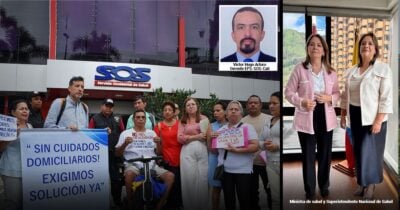 Las2orillas.co: Historias, voces y noticias de Colombia Group of people protest outside a health clinic holding a banner reading 'Sin cuidados domiciliarios! Exigimos solución ya'; an inset portrait of a man labeled Victor Hugo Arturo appears in the top corner. - Las2orillas.co: Historias, voces y noticias de Colombia