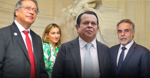 Se le acabó la fiesta a Euclides Torres, el financiador de Petro y Benedetti, con sus negocios alrededor del tránsito Four adults in business attire pose for a group photo indoors, with a decorative statue behind them. - Se le acabó la fiesta a Euclides Torres, el financiador de Petro y Benedetti, con sus negocios alrededor del tránsito
