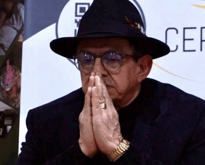 El embajador de Irán que asumió cuando Petro era presidente tendrá que empacar maletas a la carrera - Older man wearing a black hat and glasses with hands pressed together in prayer or contemplation. - El embajador de Irán que asumió cuando Petro era presidente tendrá que empacar maletas a la carrera -