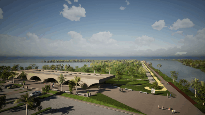 Coastal park scene with palm trees, a long walkway, and a water canal extending to the horizon under a clear blue sky. - Mota-Engil de Portugal y un consorcio local se pelean el mega contrato para intervenir la llegada del Magdalena al mar