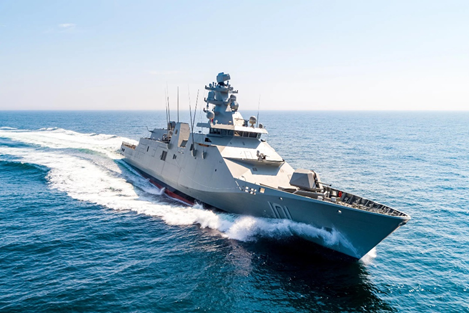 Colombia se mete en las grandes ligas navales y en Cartagena construye su primer buque de guerra de ,6 billones Gray naval warship speeding through calm open ocean, white wake trailing behind the bow. - Colombia se mete en las grandes ligas navales y en Cartagena construye su primer buque de guerra de ,6 billones